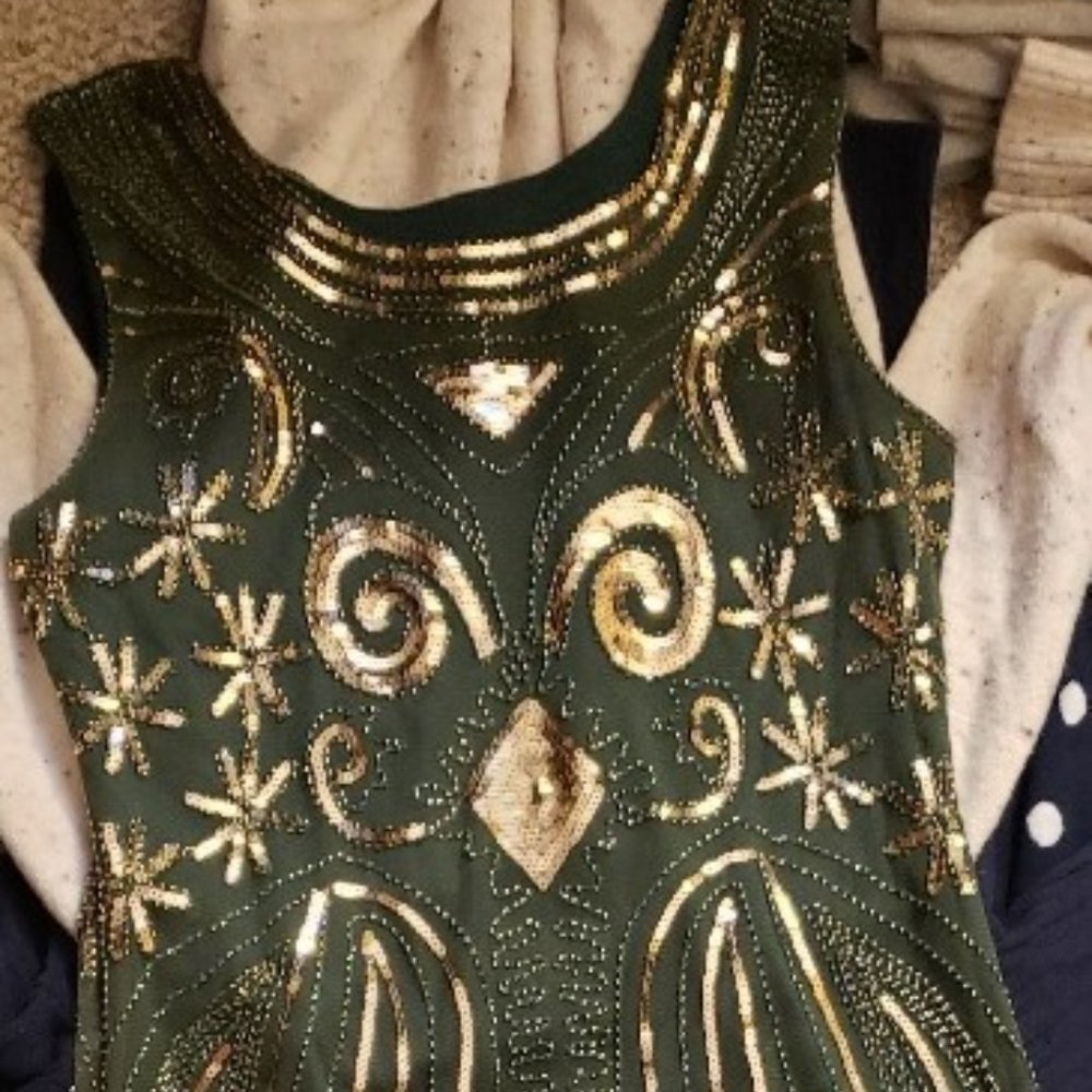 Owl print flapper dress with dangly strings at the bottom